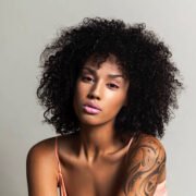 Beautiful black woman with pink eye shadow and pink lips